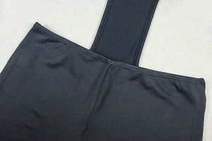 Close-up of black bodycon bodysuit showing high-quality stitching and elastic fabric texture