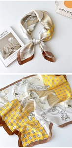 Macro shot of tricolor silk scarf with vintage floral and wavy patterns in warm tones