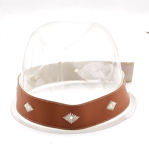 Close-up of brown leather hat band featuring white starburst embroidery detail