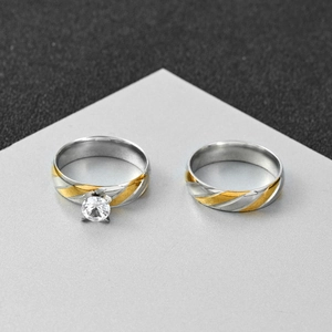 Two-tone 6mm stainless steel couple rings set with wavy gold accents and zircon stone