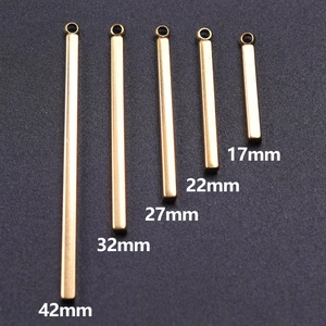 Detailed view of five golden stainless steel bar pendants in sizes from 17mm to 42mm