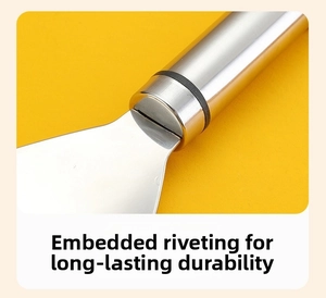 Detailed macro view of the embedded rivet joint on a stainless steel corn peeler tool