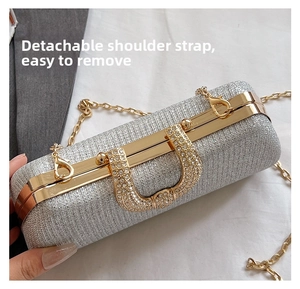 Detail of silver glitter box bag with luxury crystal U-buckle and detachable gold chain