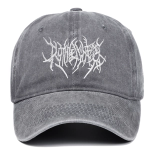 Macro detail of gothic embroidery on dark gray washed cotton punk style baseball cap