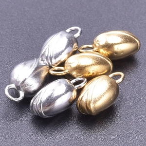 Macro shot of 304 stainless steel peanut-shaped jewelry connectors in gold and silver