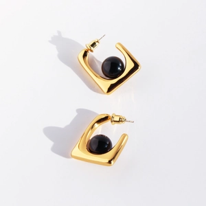 Elegant gold square earrings with black agate beads featuring a modern minimalist design