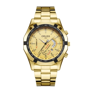 Detailed close-up of golden chronograph watch dial with three sub-dials and date window
