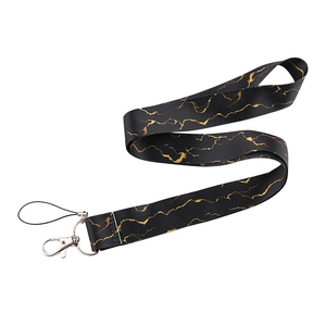 Lanyard with black and gold marble pattern featuring a metal lobster clasp and cord loop