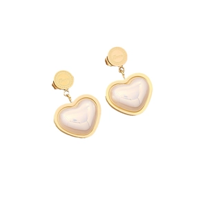 Golden heart earrings with pearl inlay and Love engraving on a white background