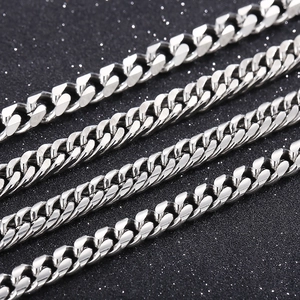 Macro shot of silver stainless steel Cuban curb chains in four different thicknesses