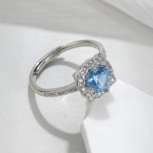 Macro shot of silver S925 ring hallmark and luxury blue gemstone setting detail