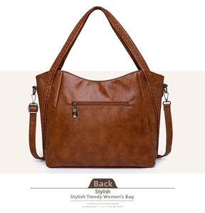 Brown vintage faux leather tote with textured finish and back zipper pocket detail