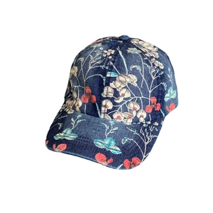 Blue denim baseball cap with floral print and wide brim in retro vintage style