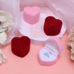 Elegant heart-shaped velvet ring box in pink and red colors for wedding or proposal