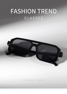 Close-up of black geometric square sunglasses with stylish double bridge and dark lenses
