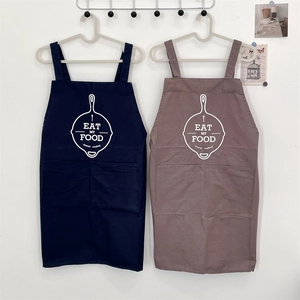 Detailed view of durable cotton linen aprons with deep pockets and lettered patterns