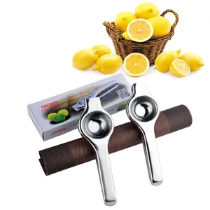 Set of two stainless steel manual lemon squeezers with box on a rustic table mat