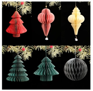Detail of paper honeycomb Christmas ornaments with gold glitter edges in various colors