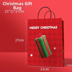 Christmas gift bag in red with Merry Christmas print and black handles 21x11x27cm