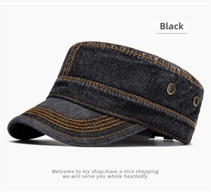 Detail of black washed denim army cap featuring orange contrast stitching and metal eyelets