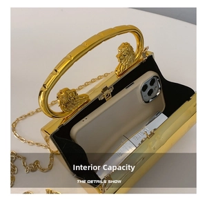 Detail view of gold evening clutch bag interior showing space for phone and lipstick
