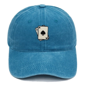 Detail of playing card embroidery on washed blue vintage cotton baseball cap