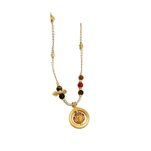 Ethnic gold pearl woven necklace with colorful beads and patterned charm pendant