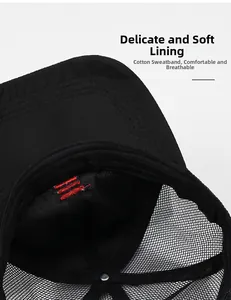 Detailed macro view of black baseball cap with breathable mesh and red stripe lining