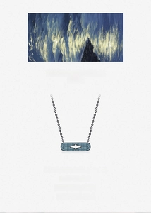 Macro detail of rectangle pendant with blue pavé crystals and silver star motif