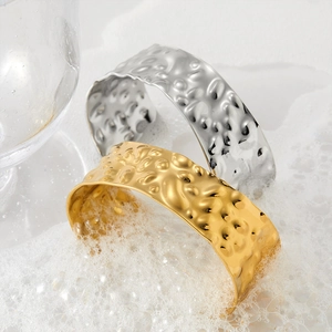 Wide stainless steel cuff bracelets with hammer texture in gold and silver finishes