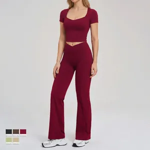 Burgundy yoga set with U-neck crop top and high-waisted flared pants for women