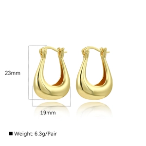 U-shaped hollow 18k gold plated earrings for women measuring 23mm by 19mm on white background
