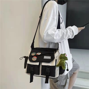 Japanese style black and white crossbody messenger bag with nylon fabric and dinosaur charm