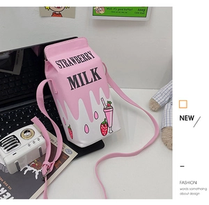 Macro detail of strawberry milk carton crossbody bag with PU leather texture and prints