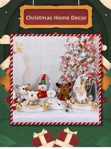 Detail of sequined Christmas plush reindeer, snowman and Santa seated home decor ornaments