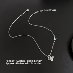 Detailed view of silver butterfly necklace showing dimensions of 1.3x1cm and chain length
