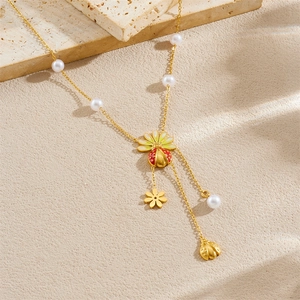 Gold ladybug and flower pendant necklace with white pearls and colorful enamel details