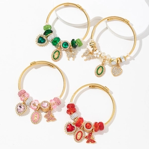 Set of four colorful Bohemian beaded bangles with crystal beads and religious charms