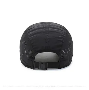 Detail of adjustable snapback buckle and laser-cut vents on black quick-dry sport cap