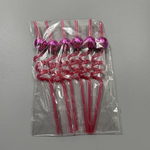 Close-up of 6-pack pink disco mirror ball spiral straws in clear plastic packaging