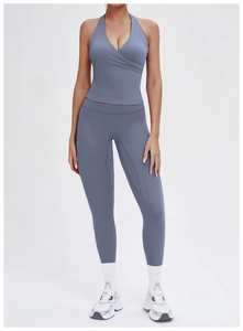 Front view of foggy blue high-waisted yoga leggings and halter wrap sports bra set