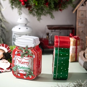 Christmas tin containers with gingerbread man design in a festive holiday display