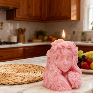 Artistic pink girl bust silicone candle mold with intricate flower details on marble base