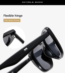 Detail einer Sonnenbrille mit kleinen Rahmen, flexiblen Scharnieren und hochwertiger Lackierung