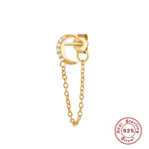 Detail of S925 sterling silver golden crescent earrings with tassel chain and zircons