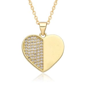 Detail showing a heart pendant necklace with micro-pave crystals and a polished gold finish