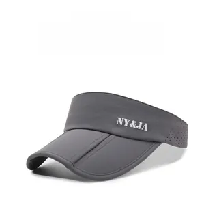 Detail view of dark grey sun visor featuring breathable laser-cut holes and NY&JA logo