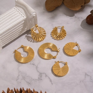 Golden geometric and leaf hoop earrings collection in minimalist vintage style