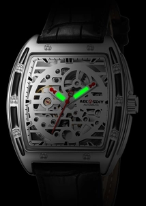 Detailed close-up of tonneau-shaped automatic skeleton watch with leather strap