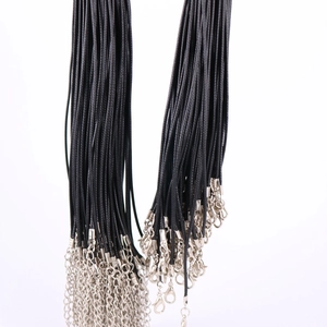 Detail of bulk black wax cord necklaces with silver lobster clasps and extension chains